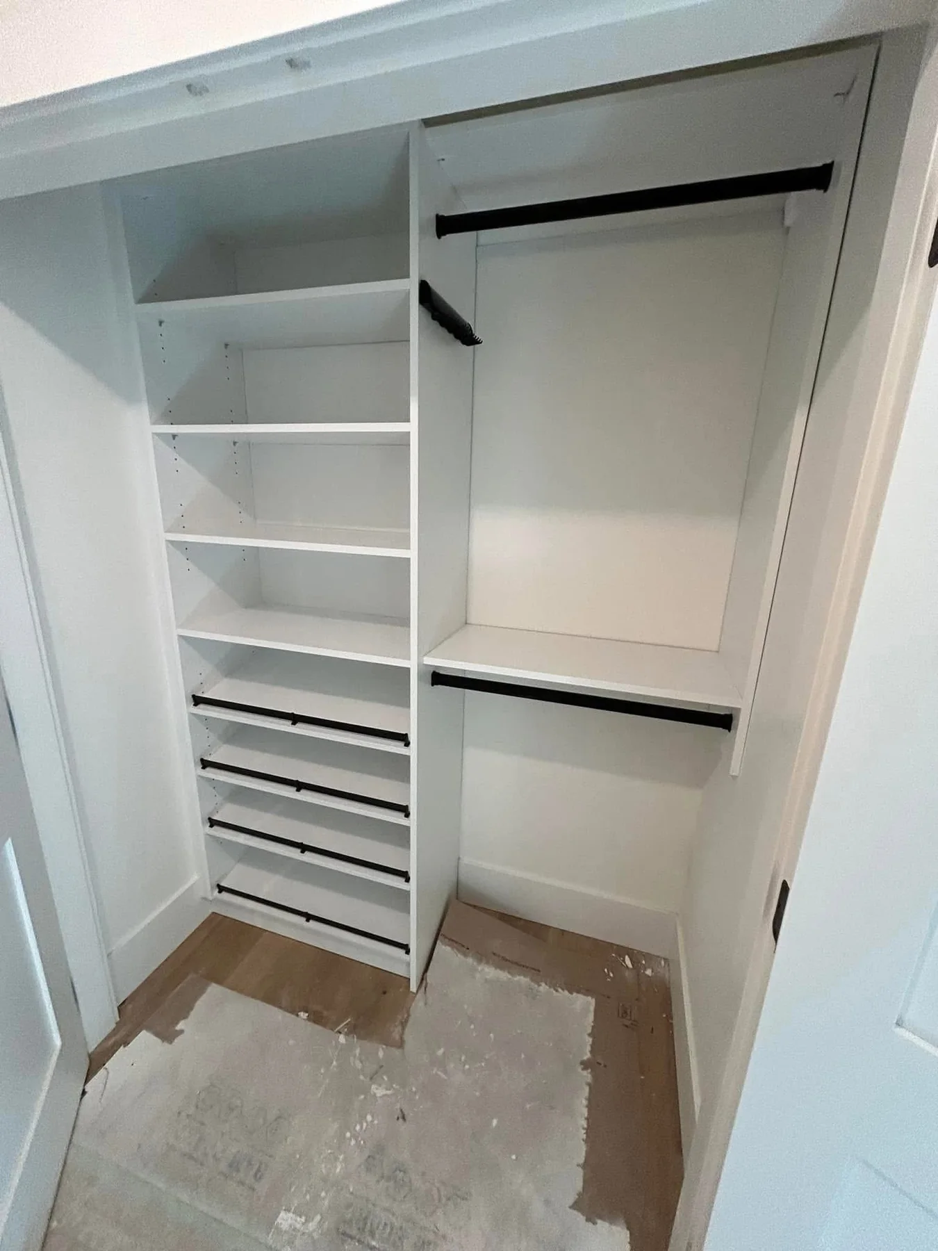 Compact white custom closet with shelves and hanging rods