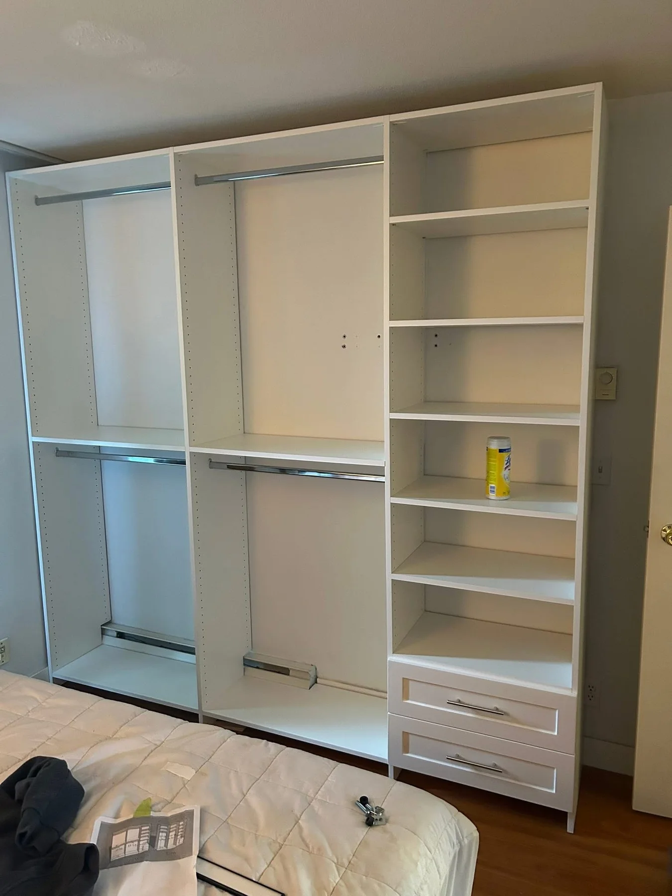 Large white wall-to-wall closet storage system